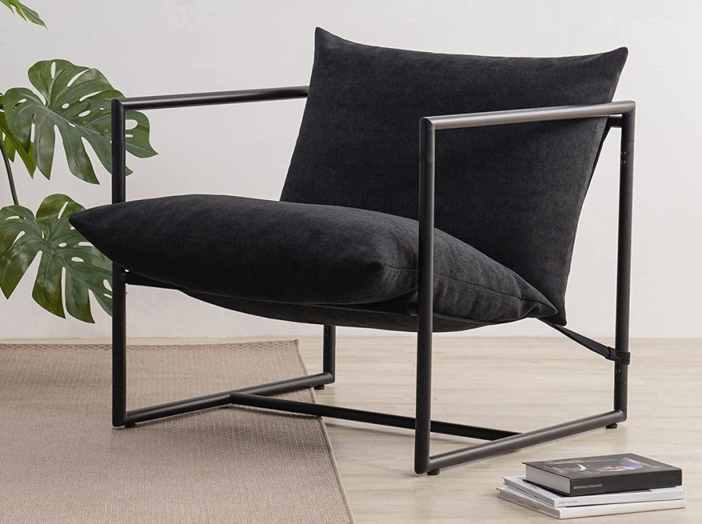 black metal frame chair with black cushions