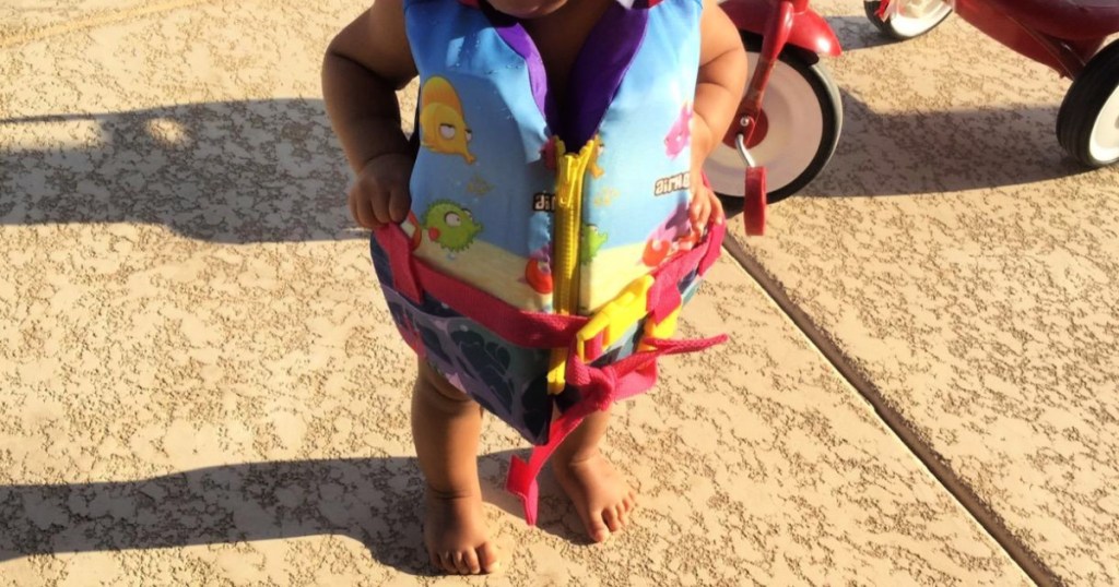 toddler wearing an airheads infant life vest