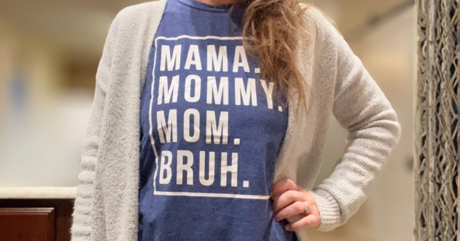 woman wearing a blue tshirt that says Mama, Mommy, Mom, Bruh