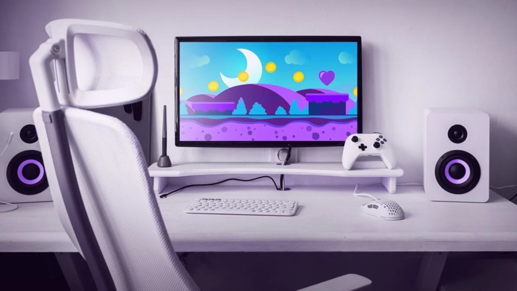 video game monitor on a white desk with white components