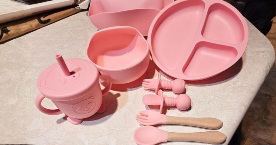 pink Baby Feeding Set on counter