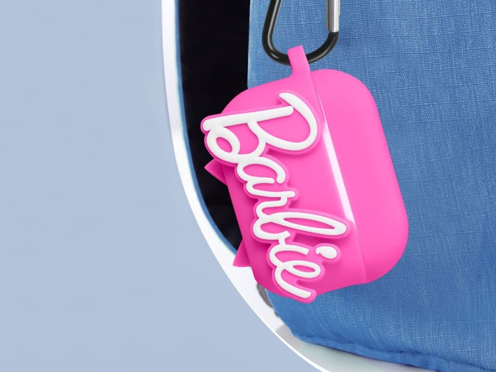 Barbie Airpods case hanging off blue backpack