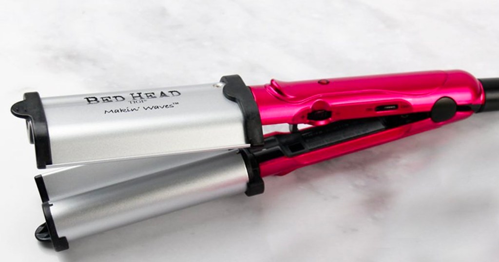 pink bed head beach waver on counter