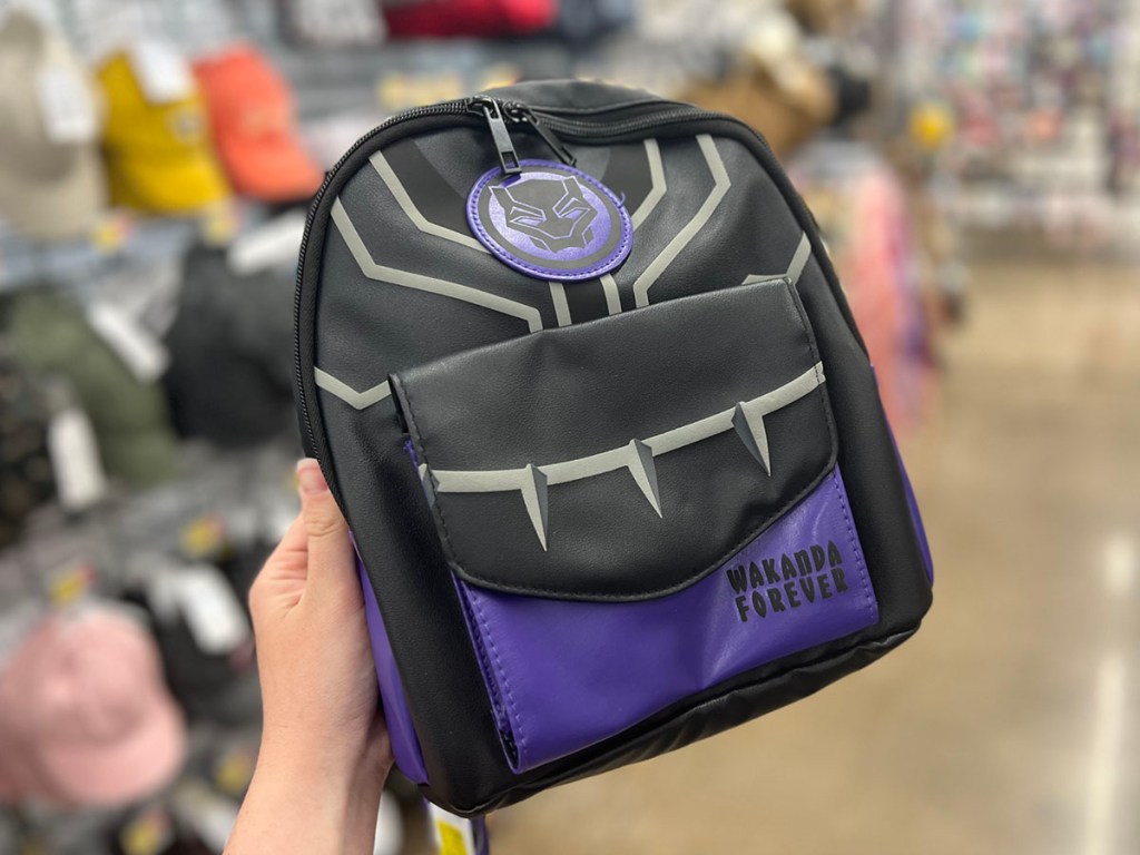 hand holding black panther mini backpack