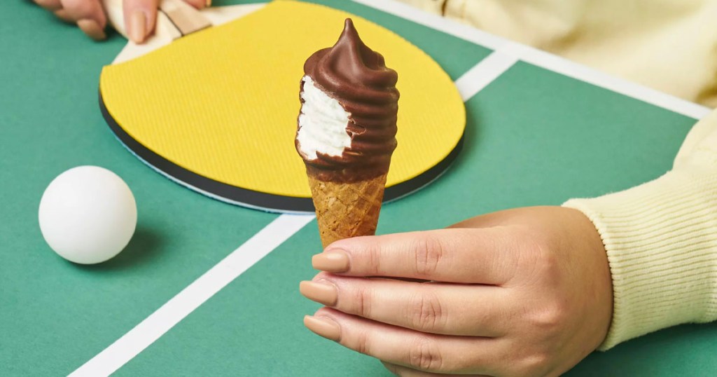 hand holding mini swirl ice cream cone