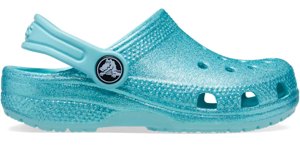 blue glitter crocs stock image