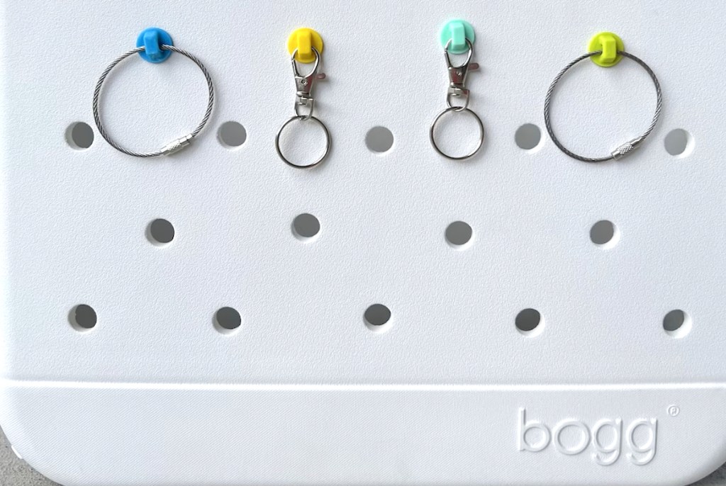 bogg bag accessories hooks on white bag with keychains