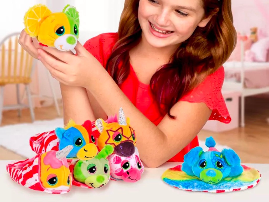 girl playing with stuffed animals