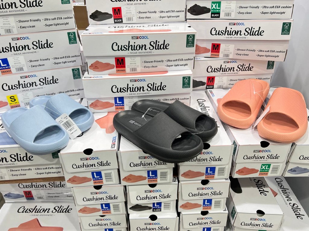 blue, black and peach cushion slides on stacked boxes in costco store