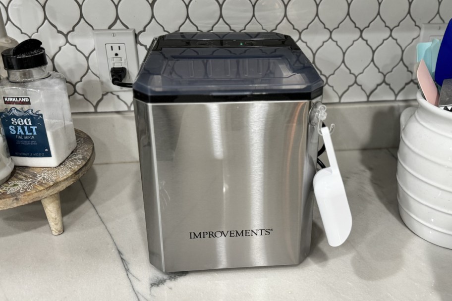 stainless steel ice maker with scoop attached