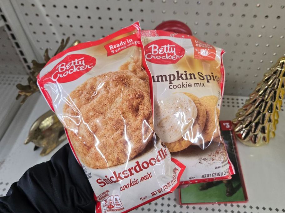 Betty Crocker Cookie Mix bags in hand in store