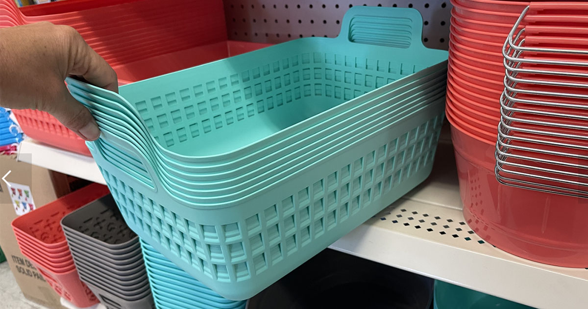 hand holding teal storage baskets