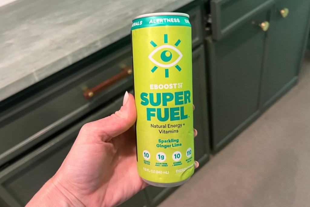 green energy drink can in hand
