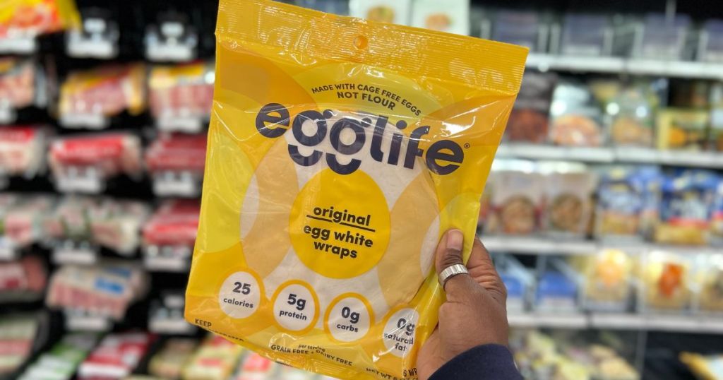 person holding package of egglife egg white wraps