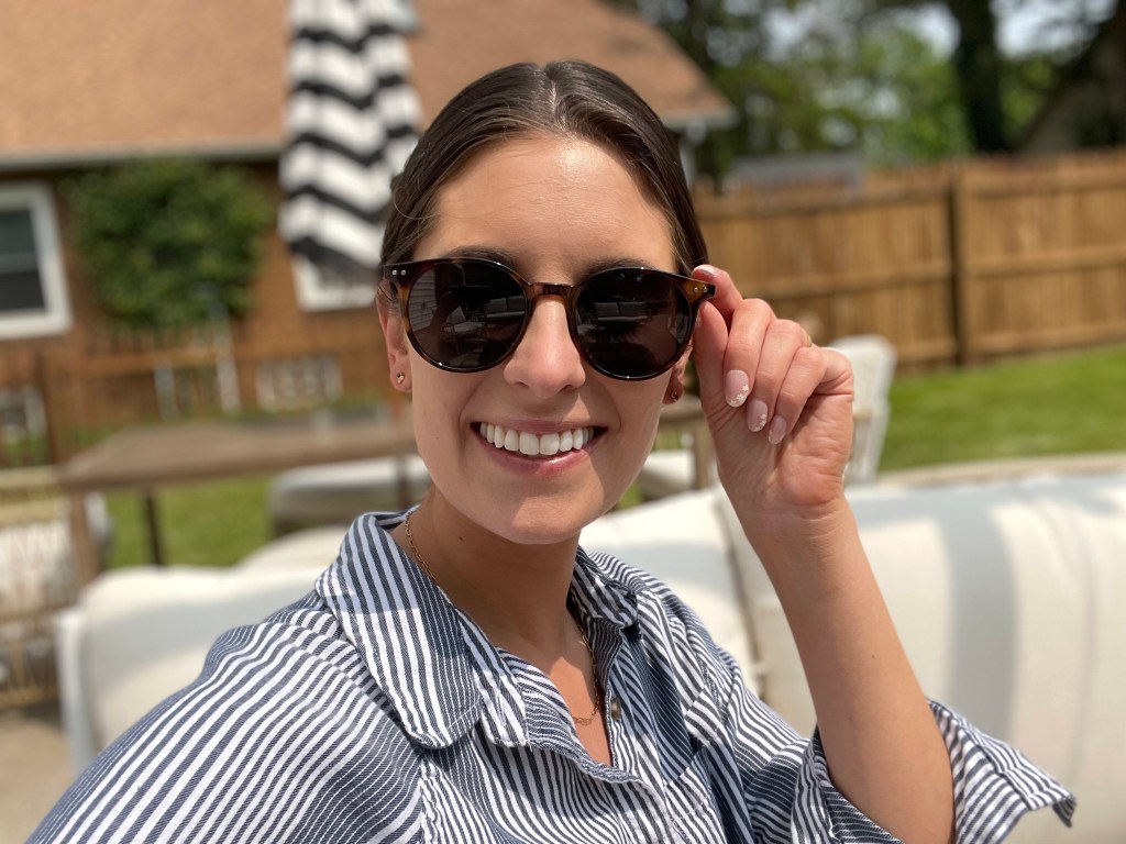 Emily wearing round sunglasses