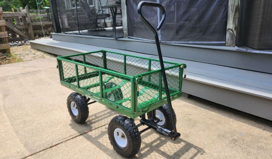 an empty gorilla garden cart on a driveway