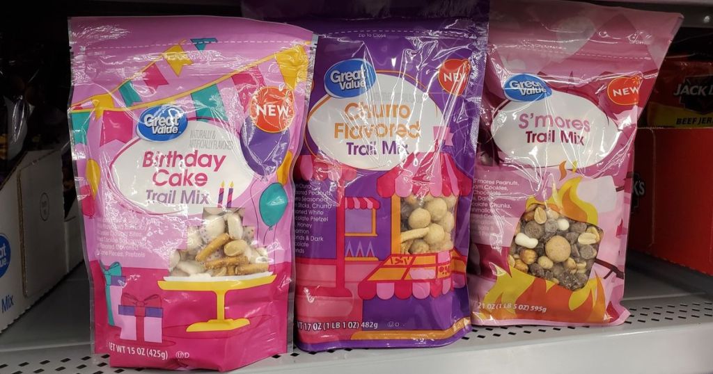 Great Value Birthday Cake, Churro, and S'mores Trail mix next to each other on shelf