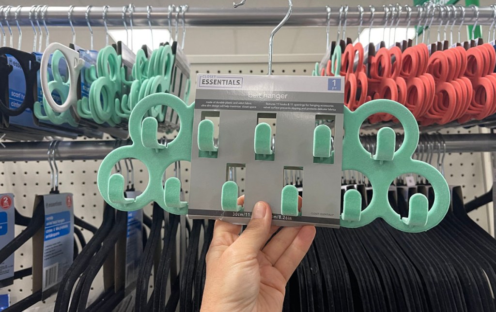 hand holding green belt hanger