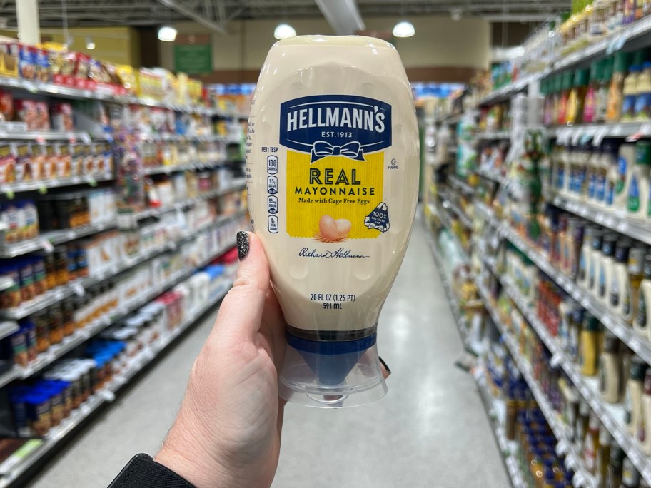 hand holding hellmanns mayonnaise