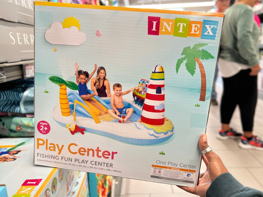 hand holding intex play center in aisle