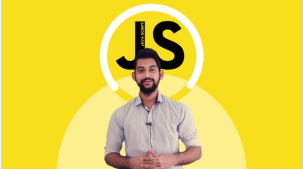 man standing in front of letters JS for javascript class