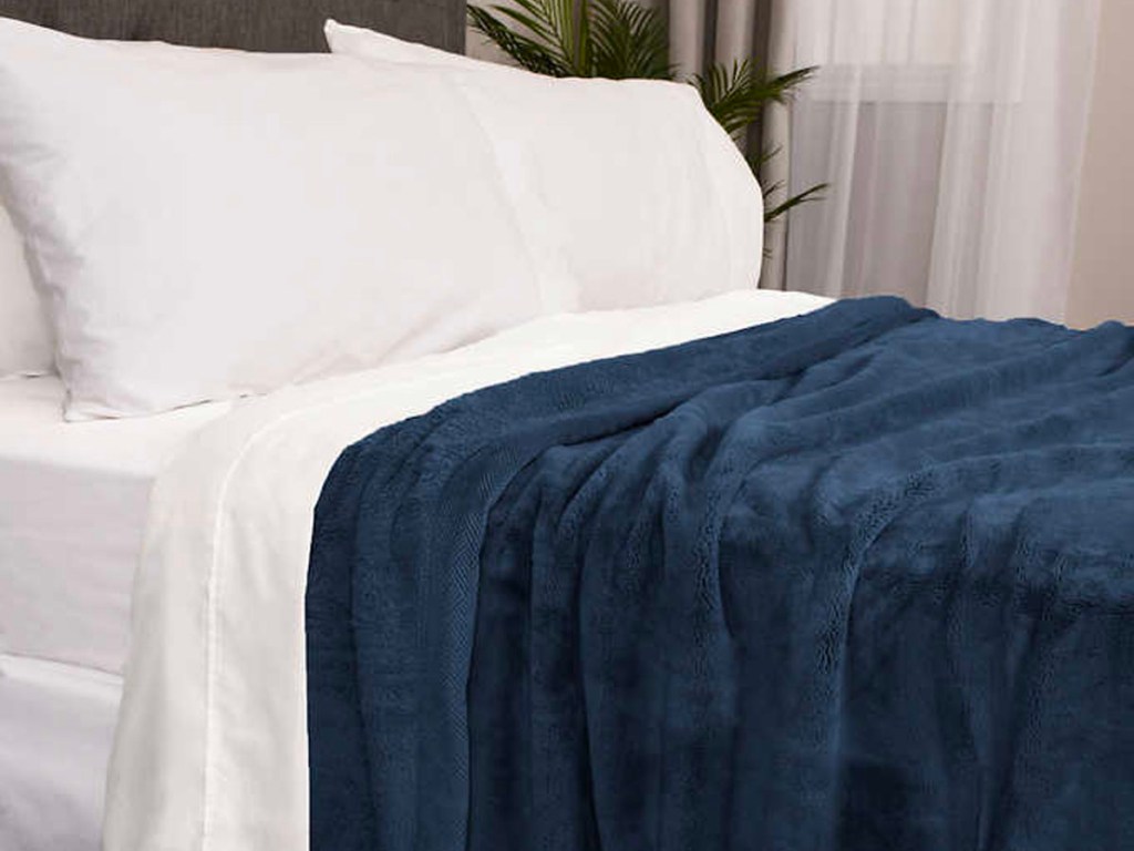 kirkland blue blanket on bed