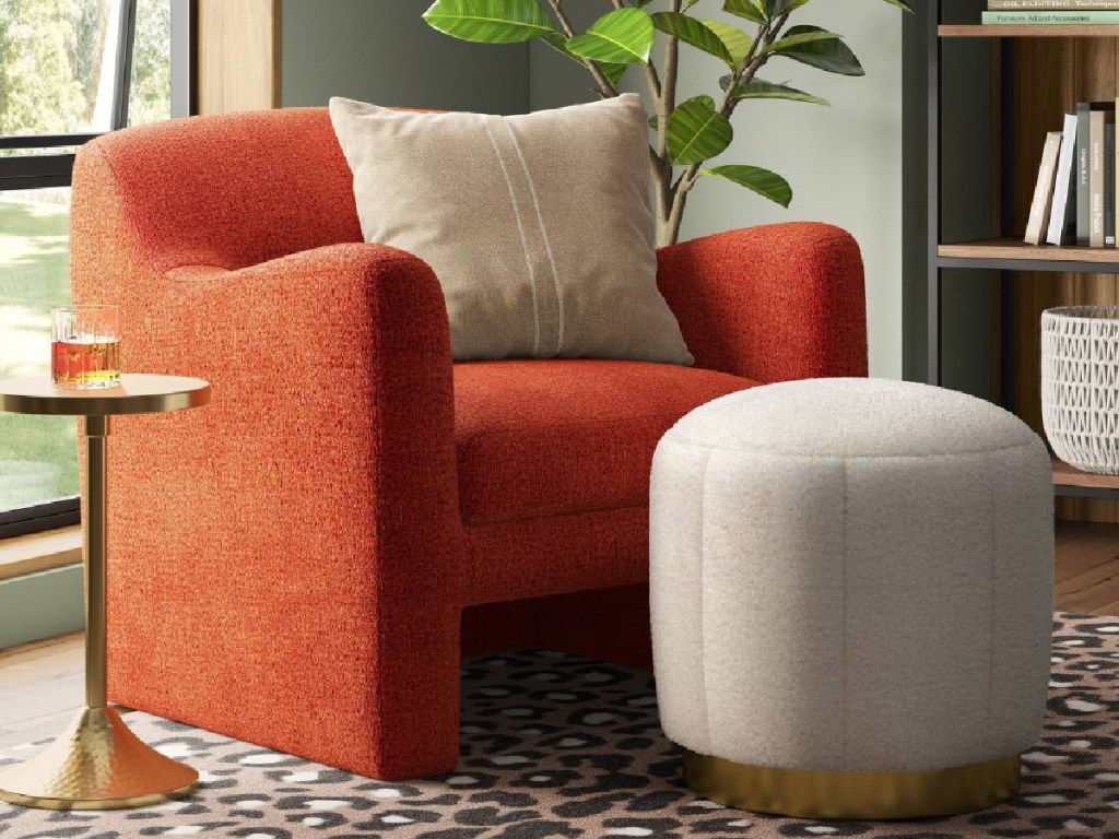 large ottoman at the end of orange chair