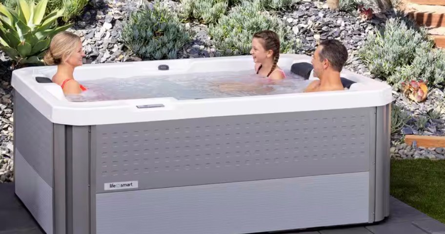 people sitting in gray hot tub 