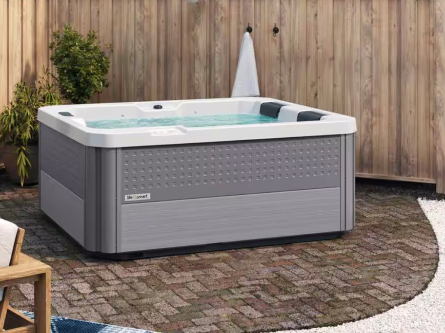 gray hot tub sitting outdoors
