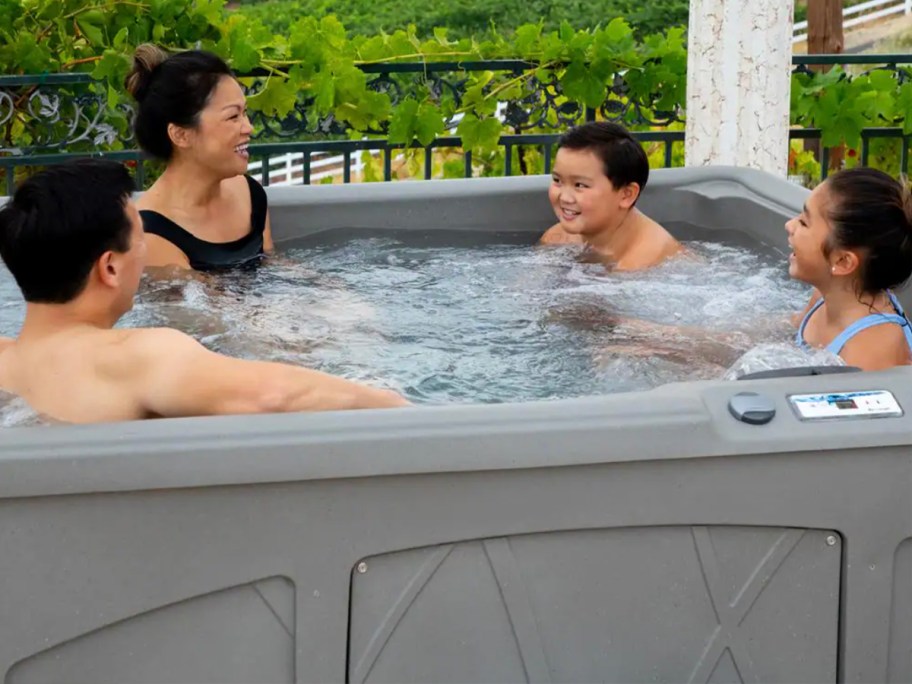 people sitting in gray hot tub