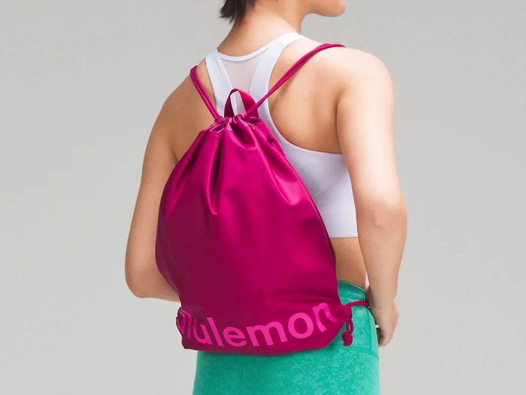 woman wearing pink lululemon Lightweight Gym Sack