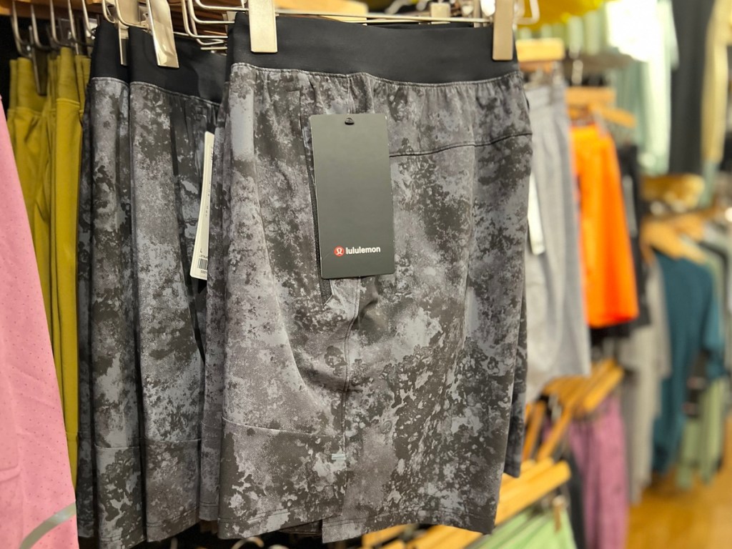 grey and black lululemon shorts on a hanger