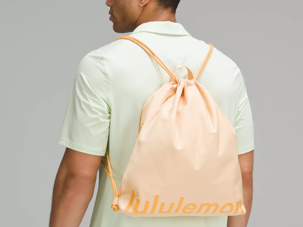 guy wearing light orange backpack