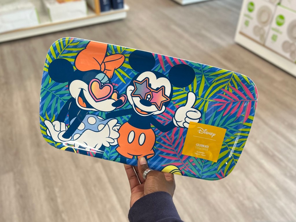 hand holding mickey and minnie serving tray