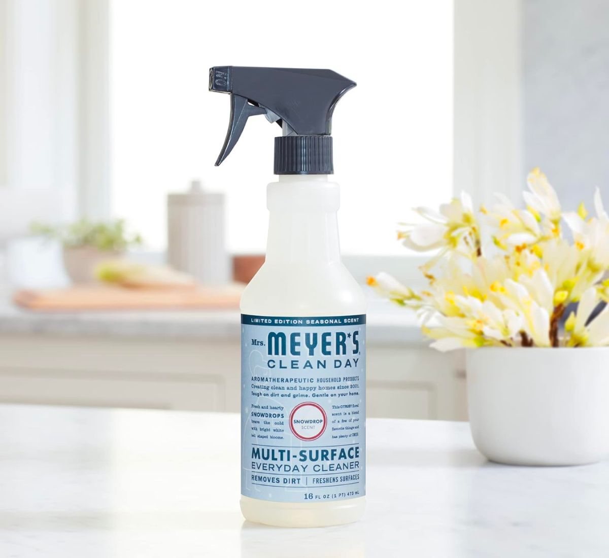 mrs meyers clean day snowdrop spray cleaner bottle on a kitchen counter