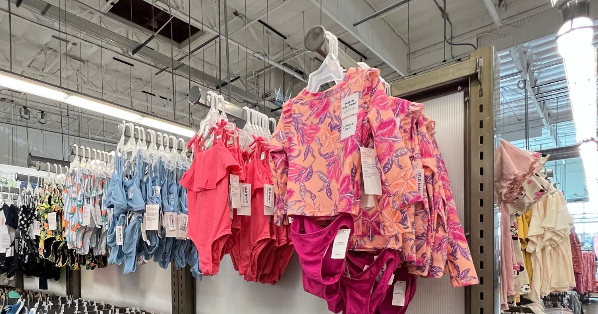 girls swimsuits hanging in store at Old Navy