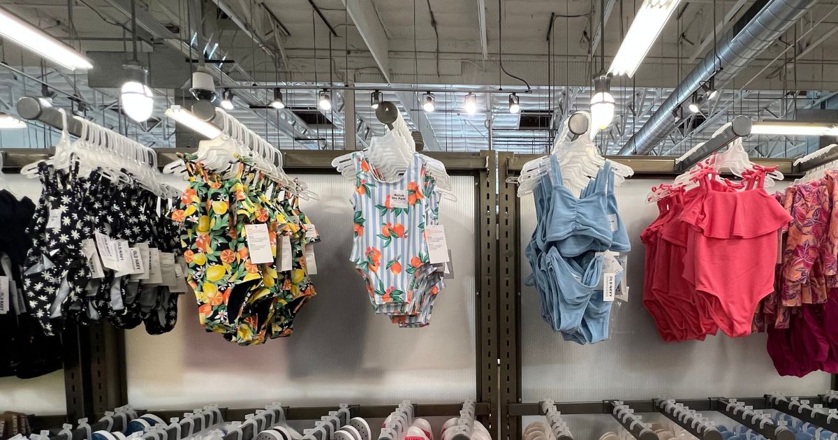 girls swimsuits hanging in store at Old Navy