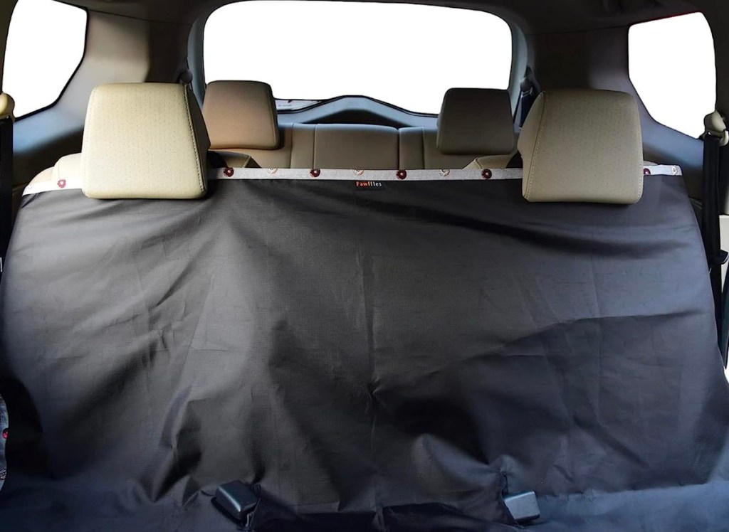 black pet car cover in backseat of car