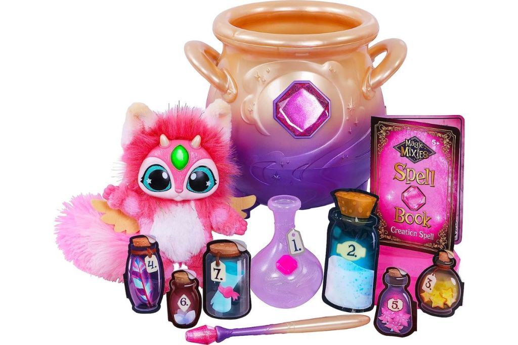 Magic Mixies Magical Misting Cauldron with Interactive Pink Plush Toy stock image