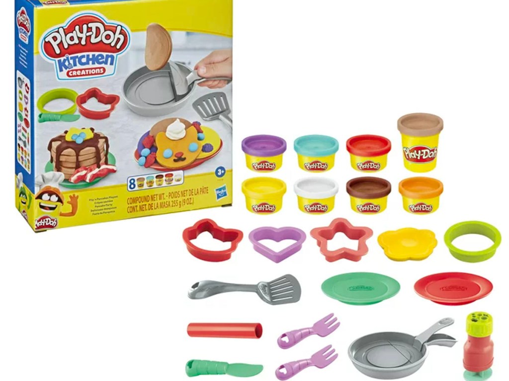 play doh kitchen creations set box with all pieces laid out in front of it. 