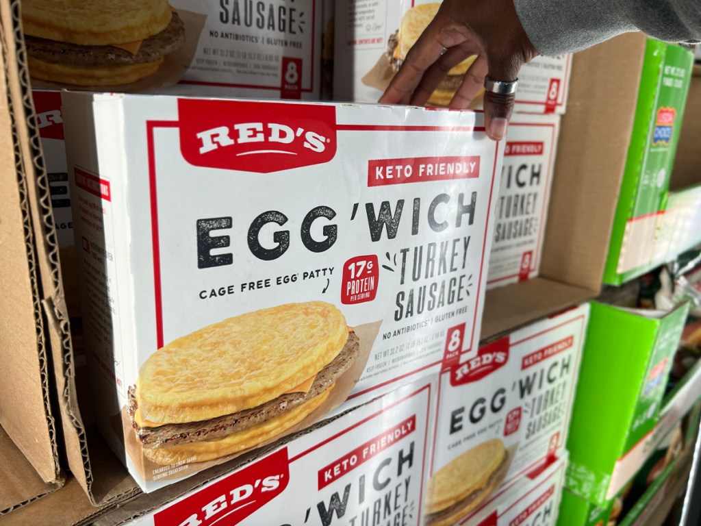 hand reaching for reds egg wich box