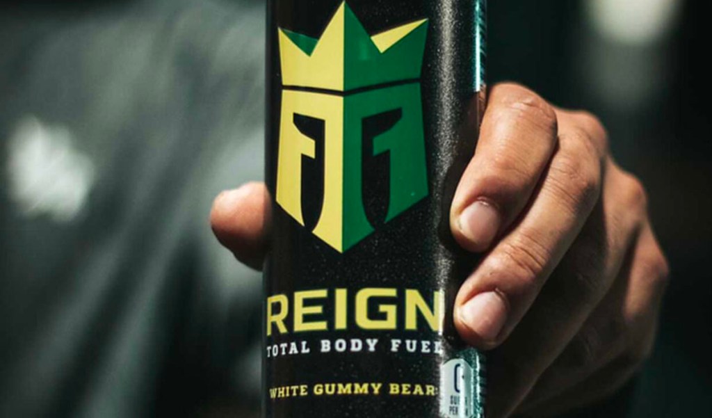 hand holding reign energy drink 