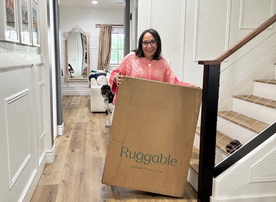 woman holding ruggable box in stairwell