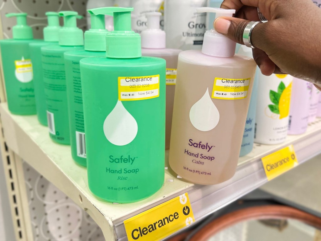 hand holding safely hand soap on shelf