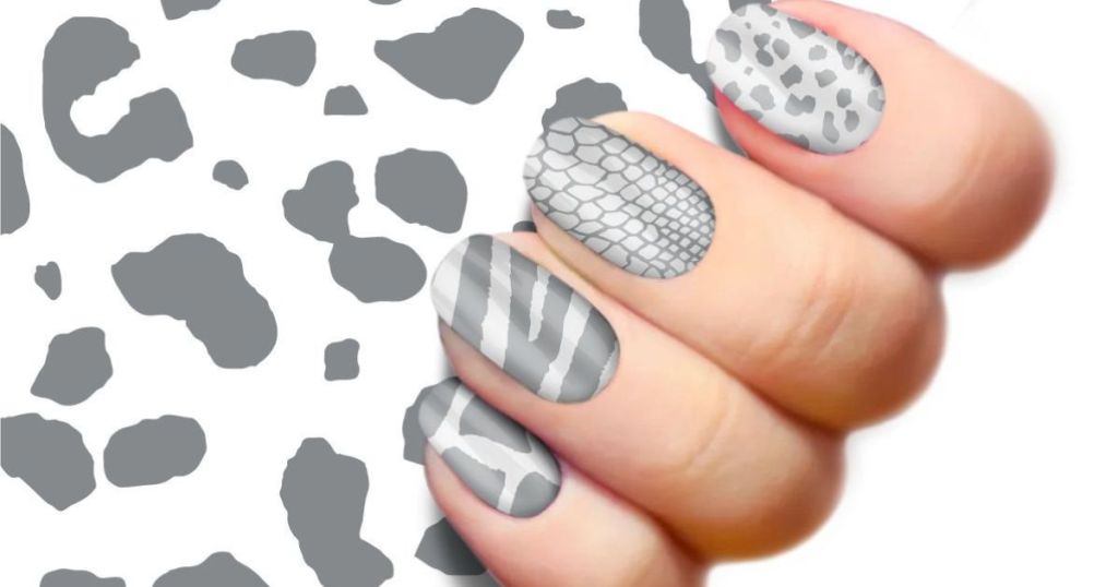 silver animal print nail wraps on hand