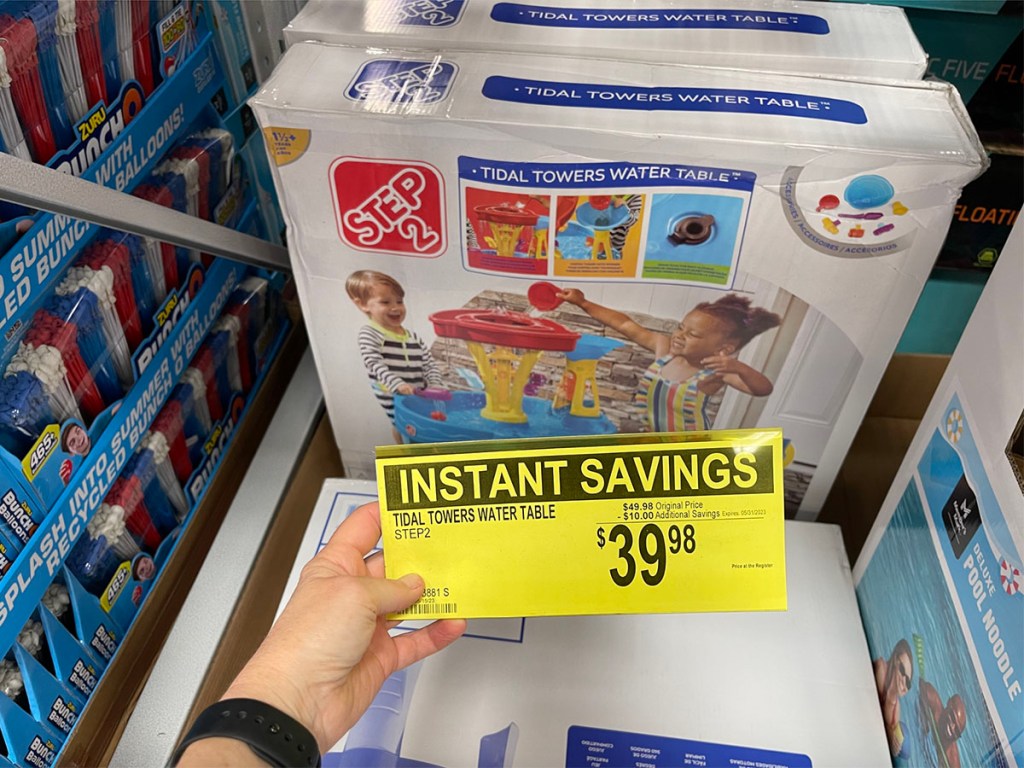 hand holding price tag in front of step 2 water table