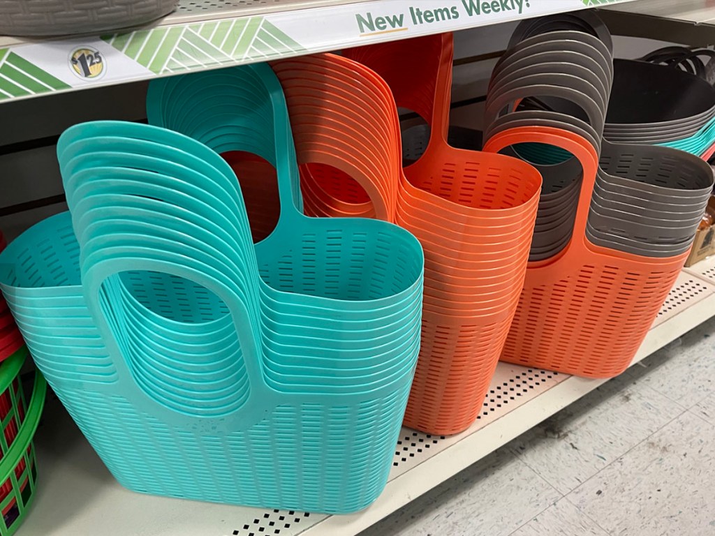 teal, orange and gray plastic totes on shelf in Dollar Tree