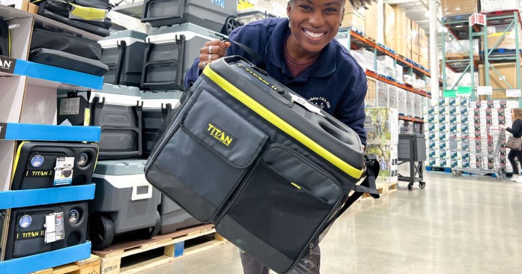 person holding Titan collapsible can cooler in store