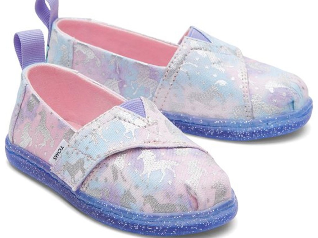 toms purple and pink unicorn shoes stock image