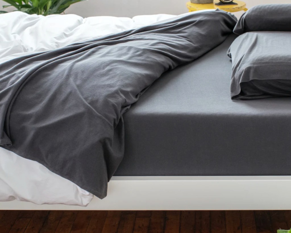 dark gray sheets on bed